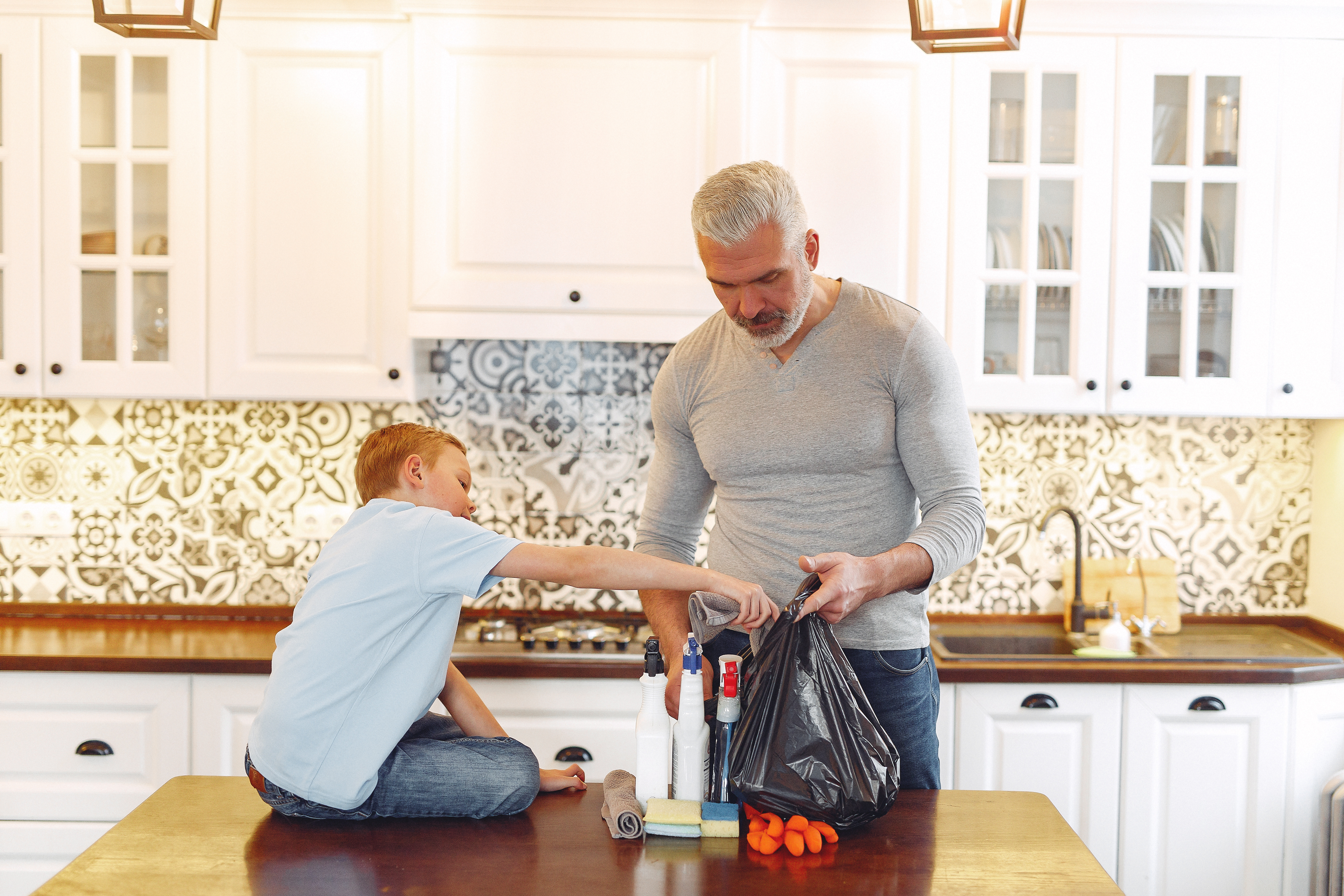 A boy with father on kitchen